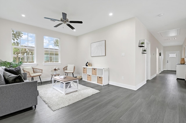 living room with dark wood-style flooring, baseboards, attic access, ceiling fan, and recessed lighting