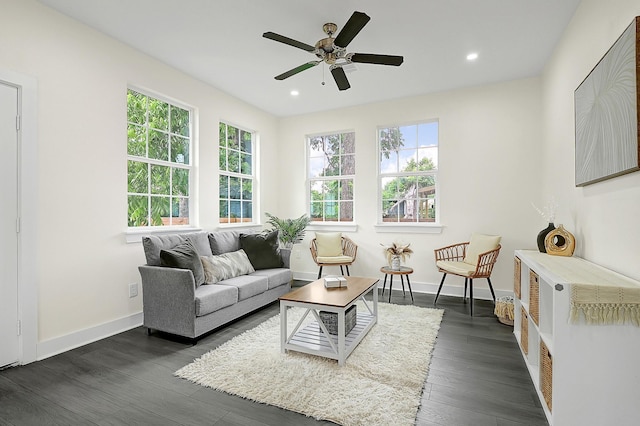 living room featuring recessed lighting, baseboards, ceiling fan, and dark wood-type flooring