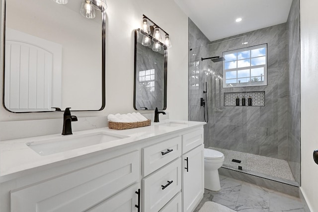 full bathroom with double vanity, walk in shower, a sink, and marble finish floor