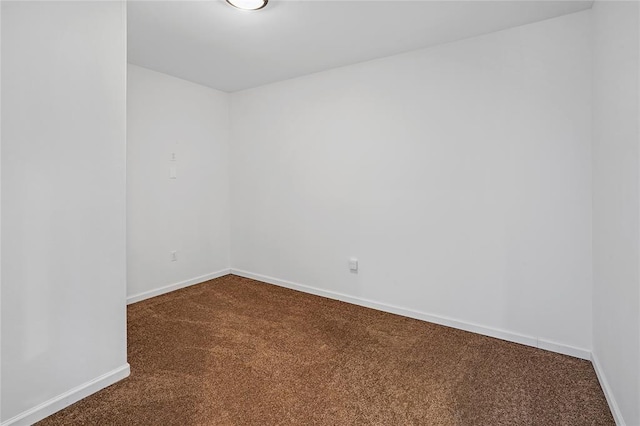 11215 Duane St, Houston, TX 77047 - empty room featuring baseboards and dark carpet