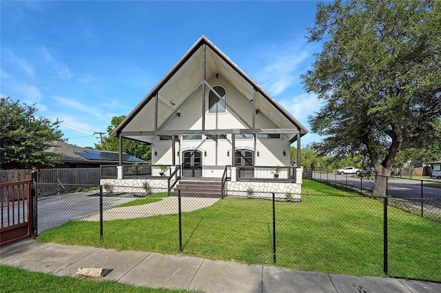 11215 Duane St, Houston, TX 77047 - view of front of property with a front yard, a fenced front yard, covered porch, and stucco siding