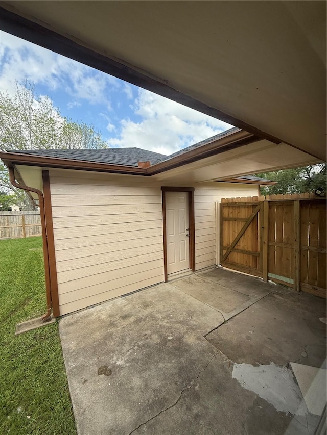 exterior space featuring fence and a gate