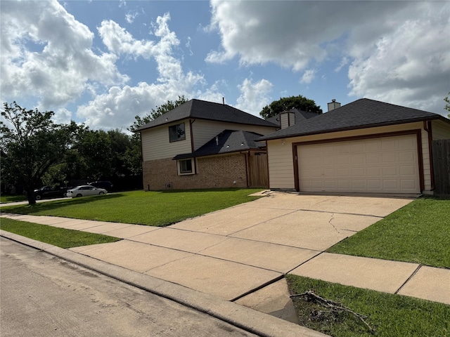 view of front facade with a front yard, a garage, brick siding, and fence