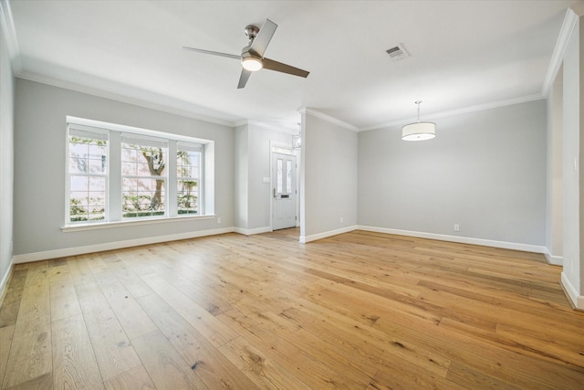 3708 Lake St, Houston, TX 77098 - spare room featuring light wood-style floors, crown molding, visible vents, and baseboards