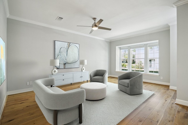 3708 Lake St, Houston, TX 77098 - living area featuring hardwood / wood-style flooring, visible vents, baseboards, ornamental molding, and a ceiling fan