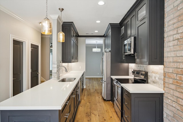 3708 Lake St, Houston, TX 77098 - kitchen with decorative backsplash, crown molding, a sink, appliances with stainless steel finishes, and light wood-style floors