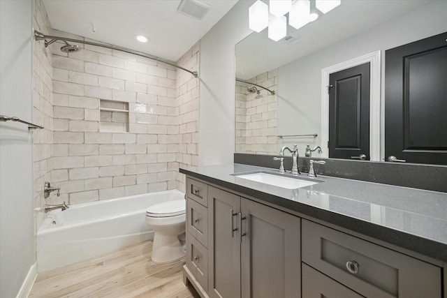 3708 Lake St, Houston, TX 77098 - bathroom featuring shower / tub combination, visible vents, toilet, wood finished floors, and vanity
