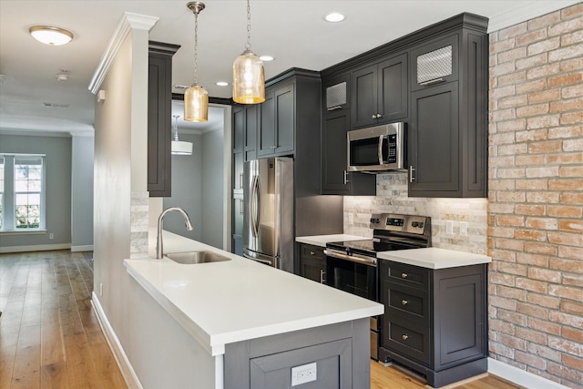 3708 Lake St, Houston, TX 77098 - kitchen with a sink, appliances with stainless steel finishes, light countertops, baseboards, and ornamental molding