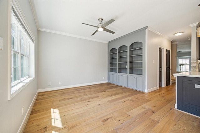 3708 Lake St, Houston, TX 77098 - empty room with ceiling fan, crown molding, light wood finished floors, and baseboards