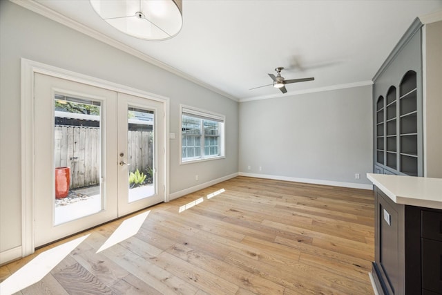 3708 Lake St, Houston, TX 77098 - interior space featuring light wood-style flooring, ornamental molding, baseboards, a ceiling fan, and french doors