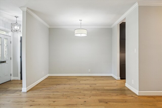 3708 Lake St, Houston, TX 77098 - unfurnished dining area featuring baseboards, light wood-type flooring, ornamental molding, and a notable chandelier