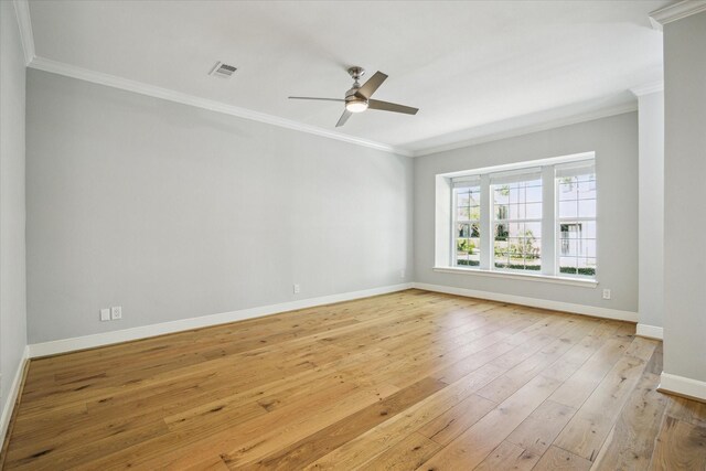 3708 Lake St, Houston, TX 77098 - spare room with ceiling fan, light wood-type flooring, visible vents, baseboards, and ornamental molding