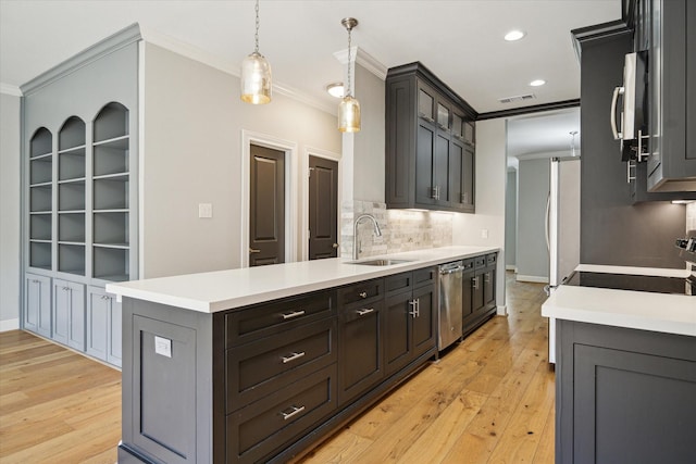 3708 Lake St, Houston, TX 77098 - kitchen with a sink, backsplash, light wood-style flooring, ornamental molding, and appliances with stainless steel finishes