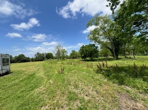 view of yard with a rural view