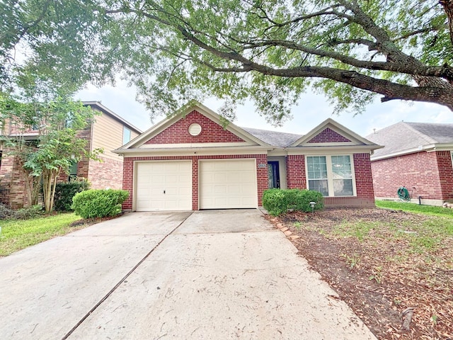 4326 Sunlit Pass Loop, Humble, TX 77396 - view of front facade featuring a garage, brick siding, and driveway