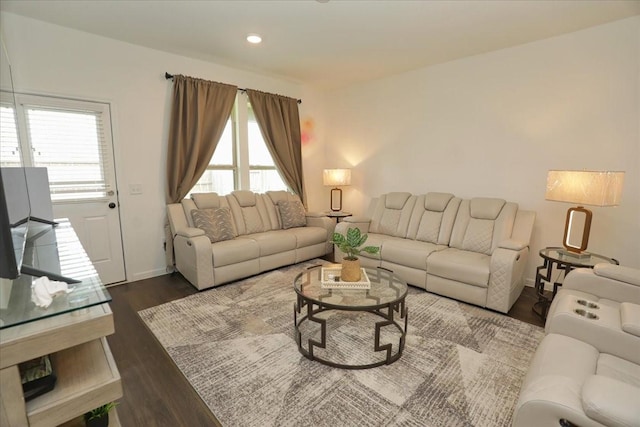 living area featuring dark wood-style flooring, plenty of natural light, recessed lighting, and baseboards