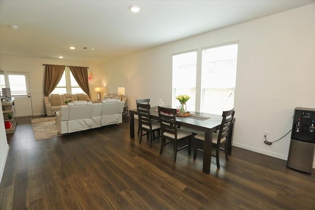 dining room with recessed lighting, baseboards, and dark wood finished floors