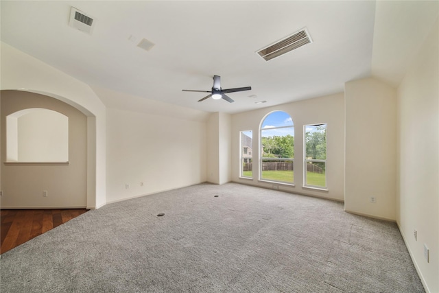 spare room with visible vents, baseboards, carpet floors, and ceiling fan