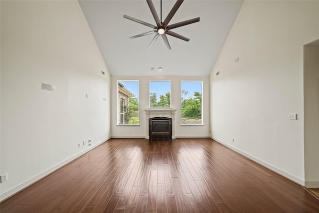 unfurnished living room featuring a fireplace with flush hearth, high vaulted ceiling, a ceiling fan, and dark wood-style flooring