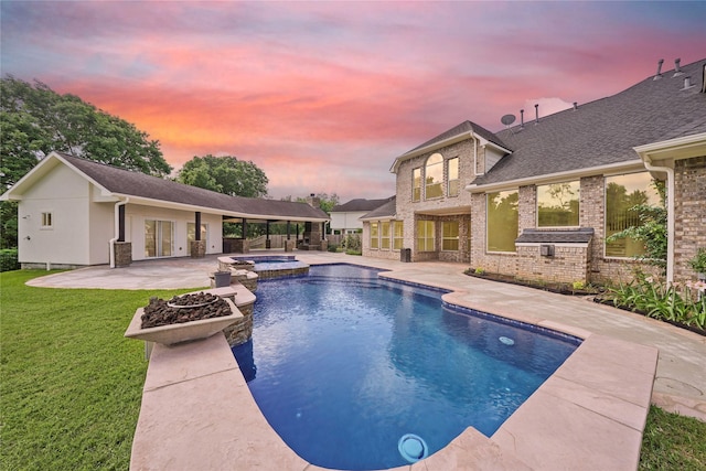 view of pool with french doors, a patio, a yard, and a pool with connected hot tub