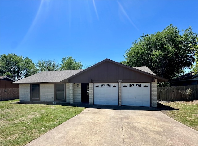 single story home with brick siding, fence, a garage, a front yard, and concrete driveway