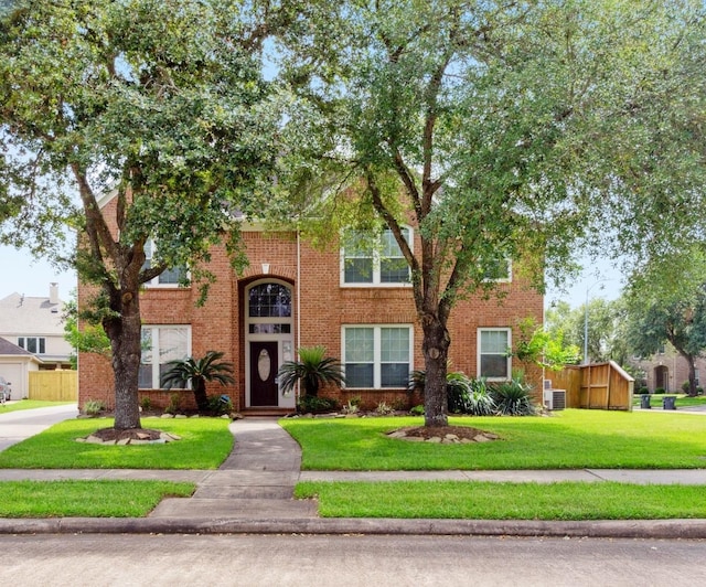 5002 Hearth Hollow Ln, Sugar Land, TX 77479 - traditional home featuring brick siding and a front lawn