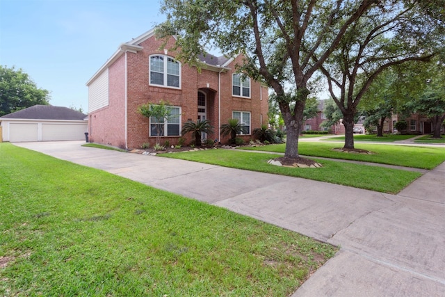 5002 Hearth Hollow Ln, Sugar Land, TX 77479 - traditional home featuring brick siding, a garage, an outbuilding, and a front yard