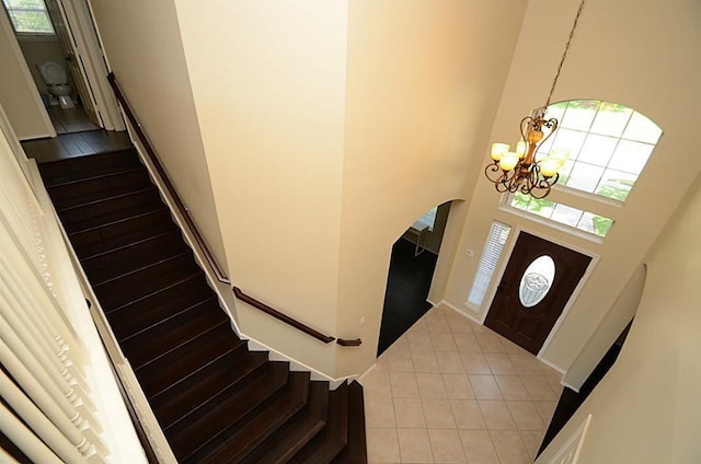 5002 Hearth Hollow Ln, Sugar Land, TX 77479 - foyer with an inviting chandelier, stairs, tile patterned flooring, and a wealth of natural light