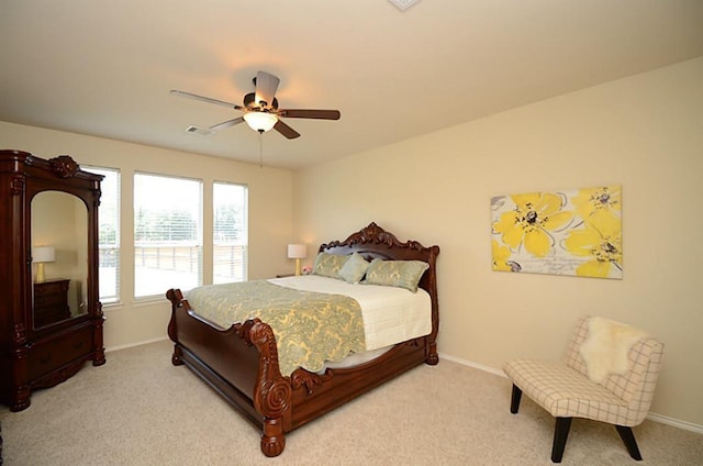5002 Hearth Hollow Ln, Sugar Land, TX 77479 - bedroom featuring visible vents, a ceiling fan, baseboards, and light colored carpet