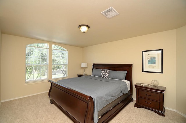 5002 Hearth Hollow Ln, Sugar Land, TX 77479 - bedroom with baseboards, light carpet, and visible vents