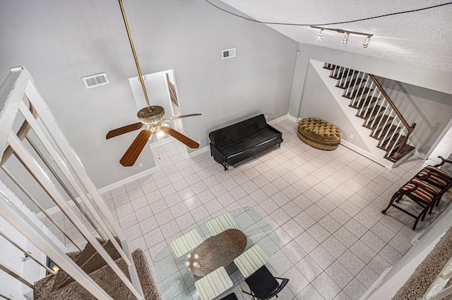 13126 Birch Grove Dr, Houston, TX 77099 - interior space featuring a textured ceiling, visible vents, ceiling fan, and baseboards