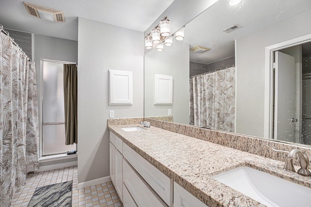 13126 Birch Grove Dr, Houston, TX 77099 - bathroom featuring double vanity, visible vents, and a sink