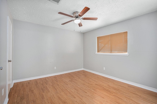 13126 Birch Grove Dr, Houston, TX 77099 - spare room with a textured ceiling, wood finished floors, and baseboards