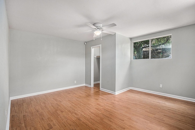 13126 Birch Grove Dr, Houston, TX 77099 - unfurnished room featuring a ceiling fan, light wood finished floors, and baseboards