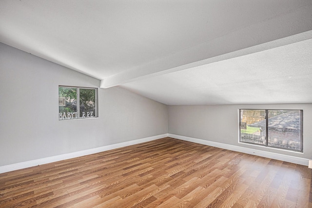 13126 Birch Grove Dr, Houston, TX 77099 - additional living space featuring wood finished floors, vaulted ceiling with beams, and baseboards