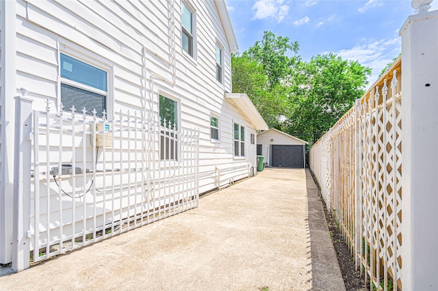 3210 Oakdale St, Houston, TX 77004 - view of home's exterior featuring an outdoor structure, a garage, and fence