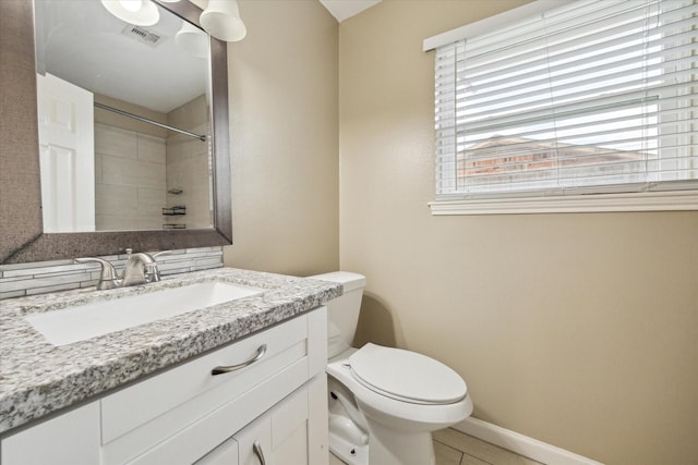 full bath featuring walk in shower, toilet, vanity, baseboards, and visible vents