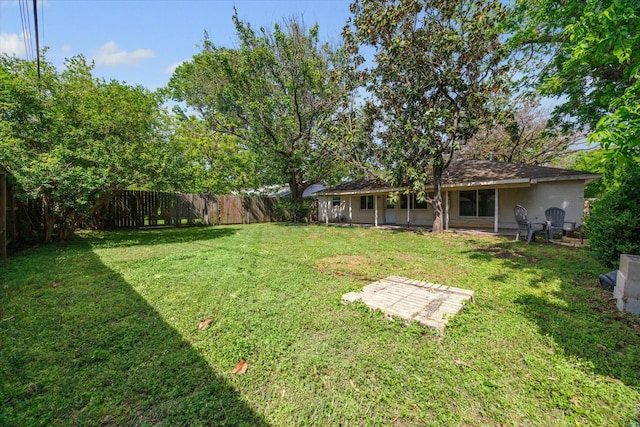 view of yard with a fenced backyard