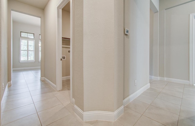 hallway featuring light tile patterned floors