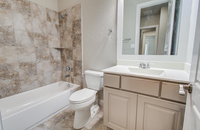 full bathroom with washtub / shower combination, vanity, toilet, visible vents, and a textured wall