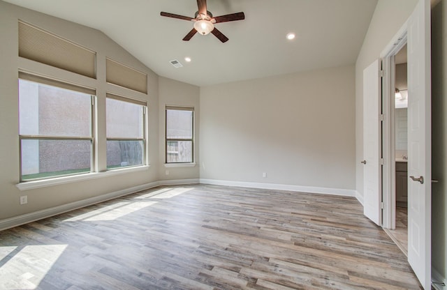 spare room featuring recessed lighting, a ceiling fan, vaulted ceiling, baseboards, and wood finished floors