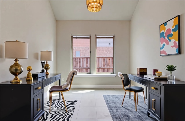 office area featuring light tile patterned floors and baseboards