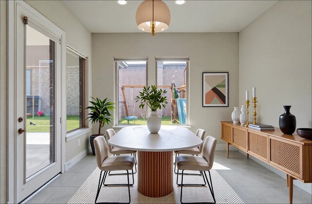 dining area with baseboards, recessed lighting, and light tile patterned flooring