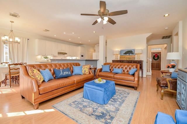 1615 Lakeside Enclave Dr, Houston, TX 77077 - living room with a chandelier, light wood finished floors, ceiling fan, and recessed lighting