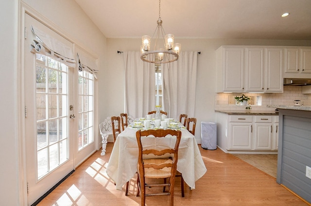 1615 Lakeside Enclave Dr, Houston, TX 77077 - dining room with a chandelier, light wood finished floors, french doors, and recessed lighting