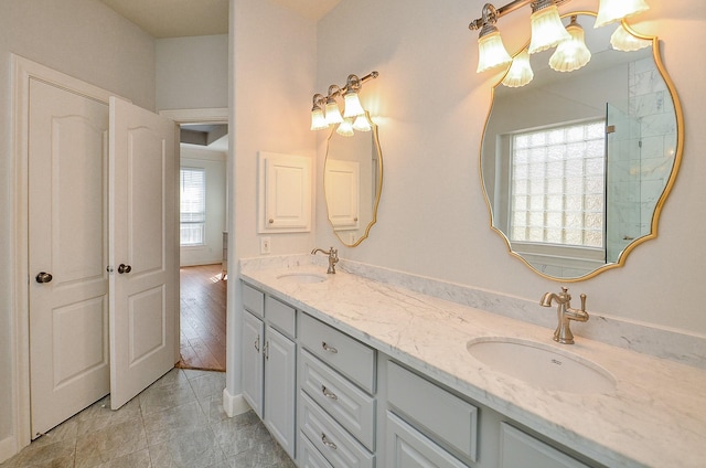 1615 Lakeside Enclave Dr, Houston, TX 77077 - bathroom with double vanity and a chandelier