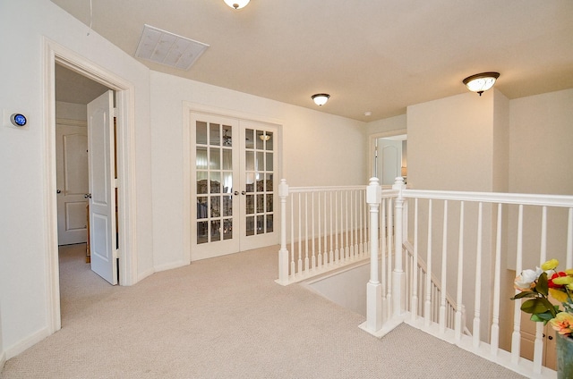 1615 Lakeside Enclave Dr, Houston, TX 77077 - hallway featuring an upstairs landing, french doors, carpet flooring, and baseboards