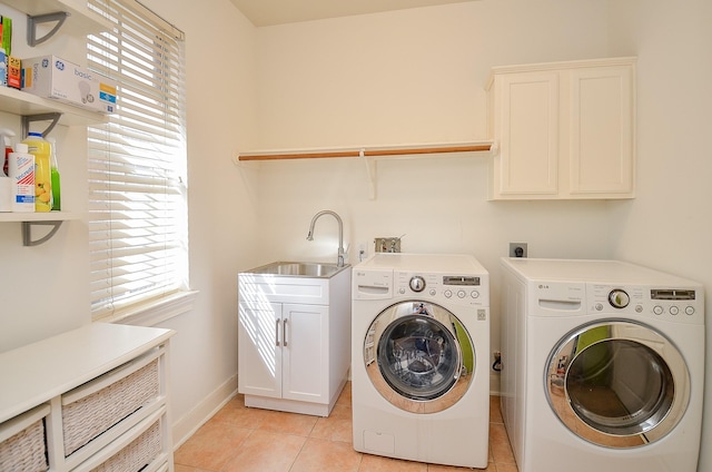 1615 Lakeside Enclave Dr, Houston, TX 77077 - washroom with washer and dryer, healthy amount of natural light, and light tile patterned floors