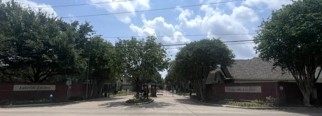 1615 Lakeside Enclave Dr, Houston, TX 77077 - view of concrete street with curbs and a gated entry
