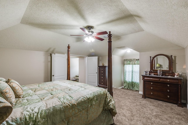 carpeted bedroom with lofted ceiling, a textured ceiling, a ceiling fan, and baseboards